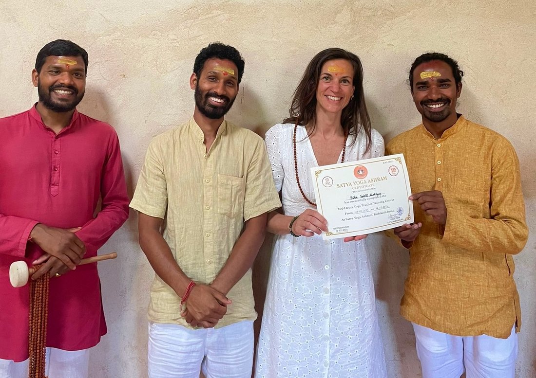 Julie Sablé receiving her Satya Yoga Ashram diploma, founder of SWA